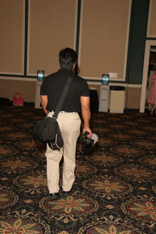 Victor Carreon With Camera at Convention Photograph, July 13, 2006 (Image)
