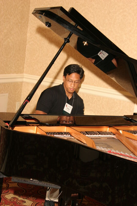 Victor Carreon Playing Piano at Convention Photograph 14, July 13, 2006 (Image)