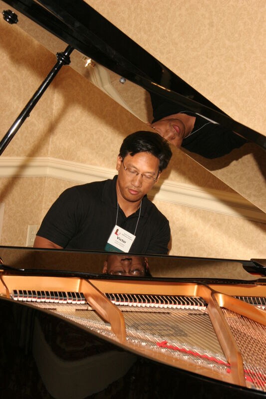 Victor Carreon Playing Piano at Convention Photograph 13, July 13, 2006 (Image)