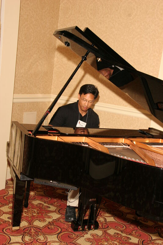 Victor Carreon Playing Piano at Convention Photograph 12, July 13, 2006 (Image)