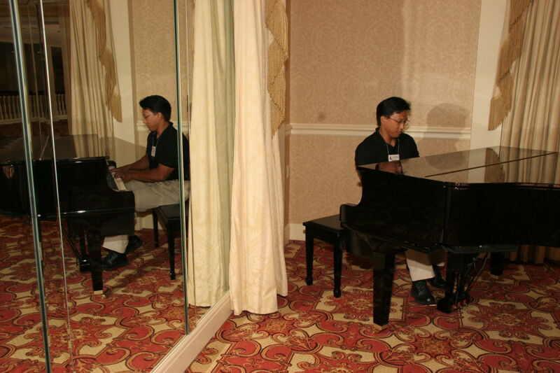 Victor Carreon Playing Piano at Convention Photograph 7, July 13, 2006 (Image)