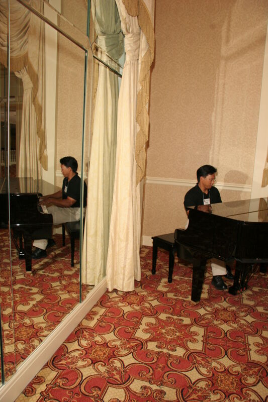 July 13 Victor Carreon Playing Piano at Convention Photograph 6 Image