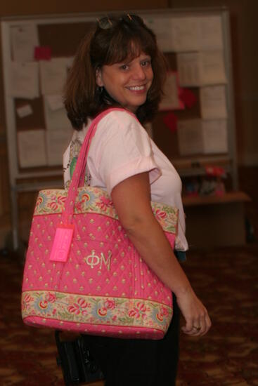 Unidentified Phi Mu With Pink Bag at Convention Photograph, July 2006 (image)