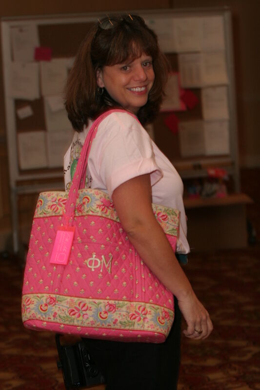 Unidentified Phi Mu With Pink Bag at Convention Photograph, July 2006 (Image)