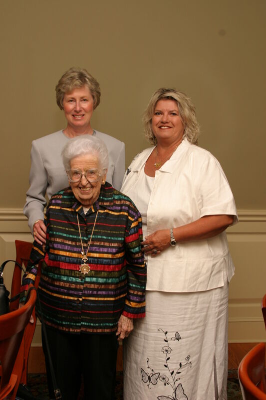 Hughes, Stone, and Unidentified at Convention 1852 Society Luncheon Photograph, July 8-11, 2004 (Image)