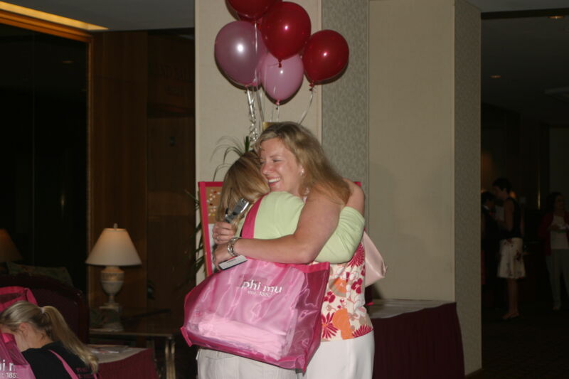 Two Phi Mus Hugging at Convention Photograph, July 8, 2004 (Image)