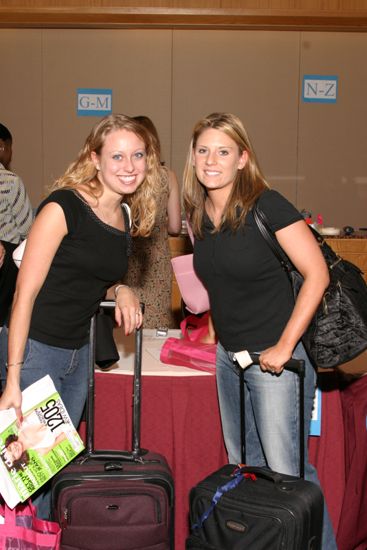 Two Phi Mus Registering at Convention Photograph 2, July 8, 2004 (image)