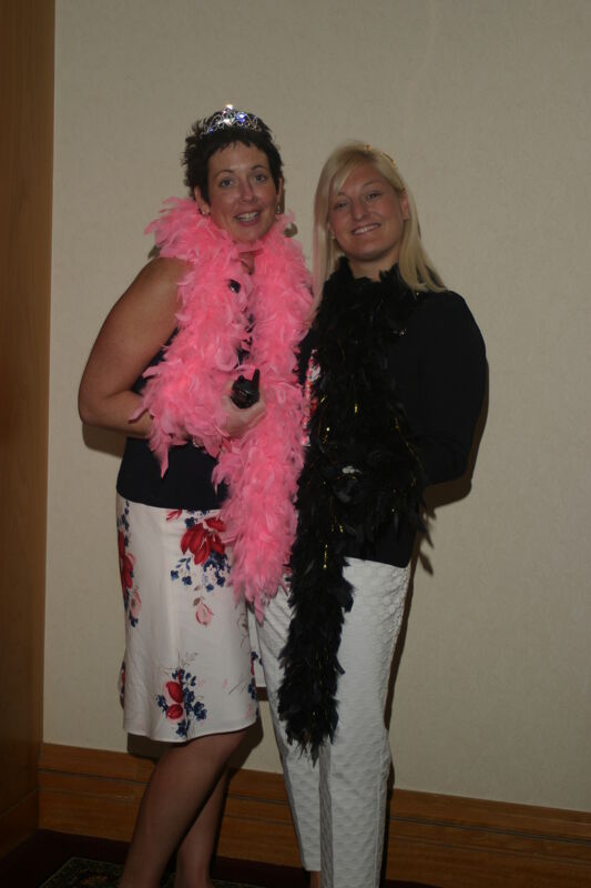 Jen Wooley and Kris Bridges Wearing Feather Boas at Convention Photograph 2, July 8, 2004 (Image)