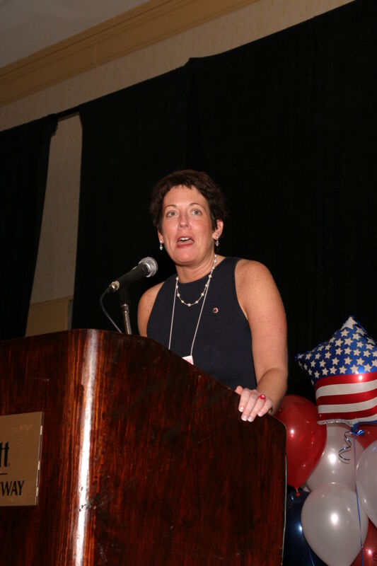 White Jen Wooley Speaking at Convention Red Image