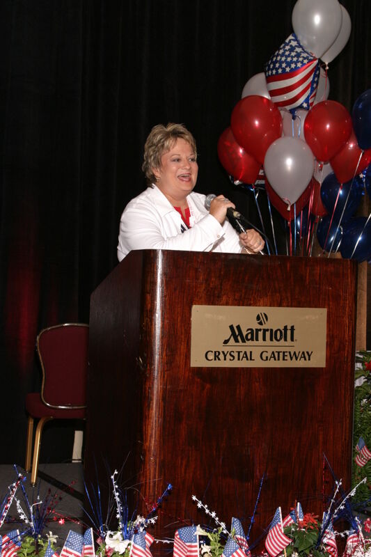 White Kathy Williams Speaking at Convention Red Image