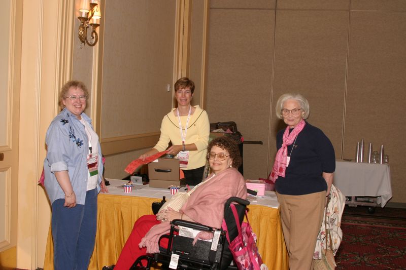 July 8 Four Phi Mus Setting Up Table at Convention Photograph Image