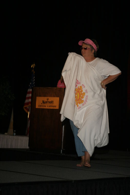 Kathy Williams With Beach Towel in Convention Fashion Show Photograph 1, July 8, 2004 (Image)