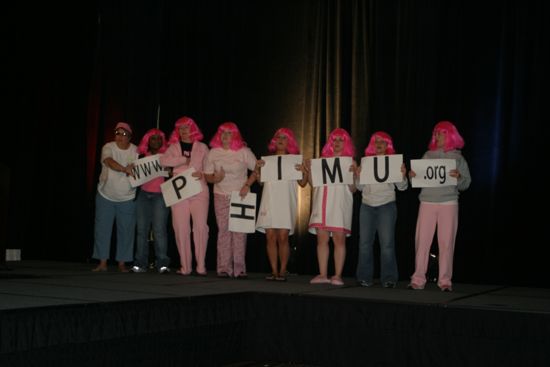 Phi Mus Holding Letters in Convention Fashion Show Photograph 3, July 8, 2004 (image)