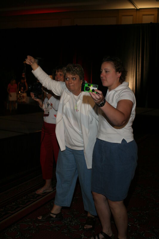 Phi Mus With Cameras at Convention Photograph, July 8, 2004 (Image)