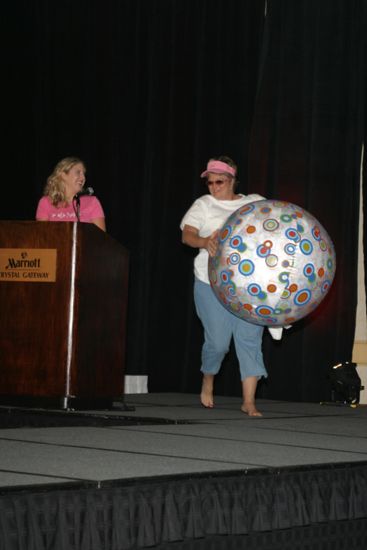 Kathy Williams With Beach Ball in Convention Fashion Show Photograph 1, July 8, 2004 (image)