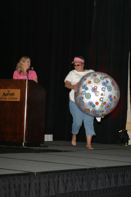 Kathy Williams With Beach Ball in Convention Fashion Show Photograph 1, July 8, 2004 (Image)