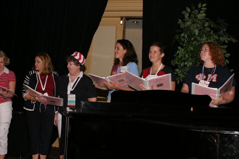 Convention Choir Singing at Red, White, and Phi Mu Dinner Photograph 1, July 8, 2004 (Image)