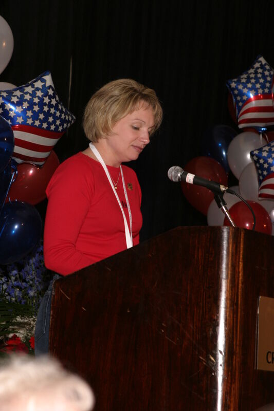 White Robin Fanning Speaking at Convention Red Image