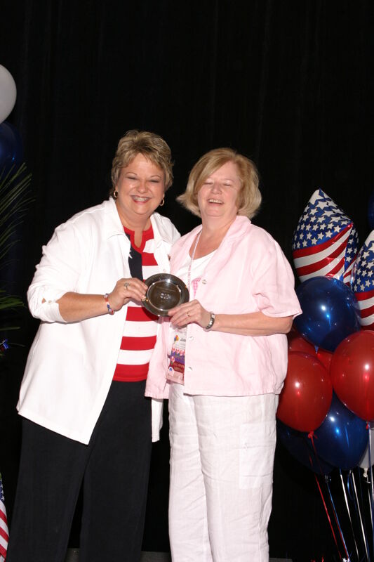 Kathy Williams and Unidentified With Award at Convention Photograph 6, July 8, 2004 (Image)