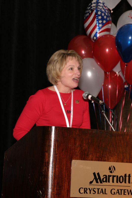 White Robin Fanning Speaking at Convention Red Image