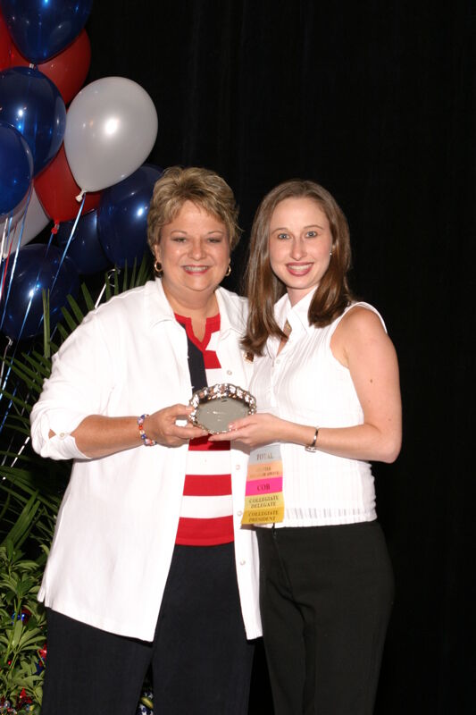 Kathy Williams and Unidentified With Award at Convention Photograph 8, July 8, 2004 (Image)