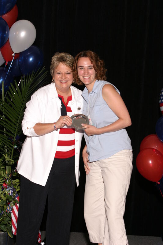 Kathy Williams and Unidentified With Award at Convention Photograph 4, July 8, 2004 (Image)