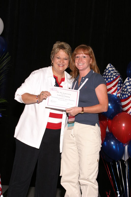 Kathy Williams and Volusia County Alumnae Chapter Member With Certificate at Convention Photograph, July 8, 2004 (Image)