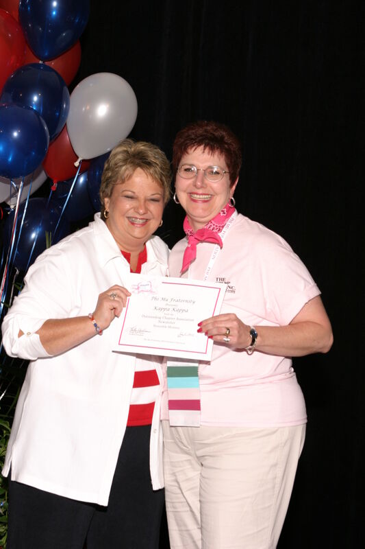 Kathy Williams and Kappa Kappa Chapter Member With Certificate at Convention Photograph, July 8, 2004 (Image)