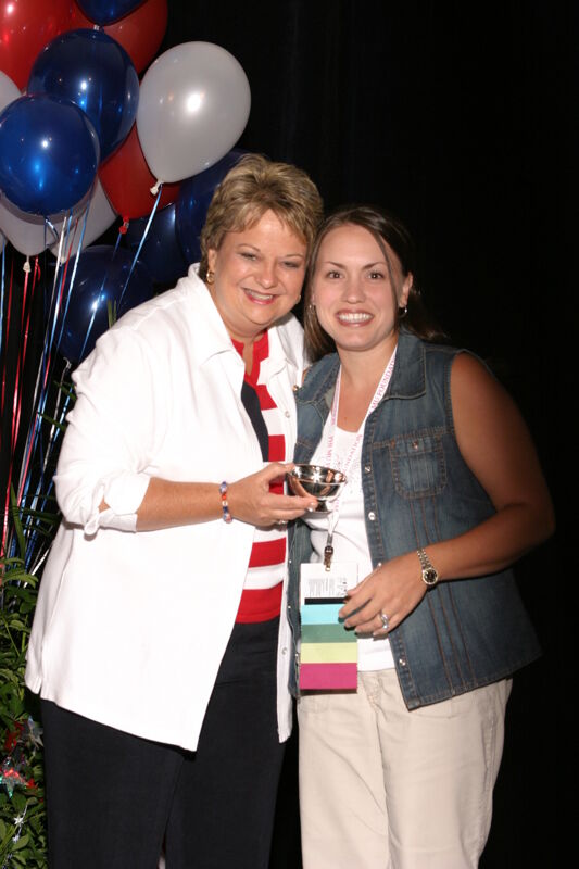 Kathy Williams and Unidentified With Award at Convention Photograph 9, July 8, 2004 (Image)