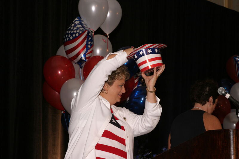 Kathy Williams With Hat at Convention Red, White, and Phi Mu Dinner Photograph, July 8, 2004 (Image)