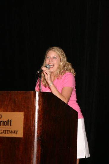 Unidentified Phi Mu Speaking at Convention Fashion Show Photograph 2, July 8, 2004 (image)