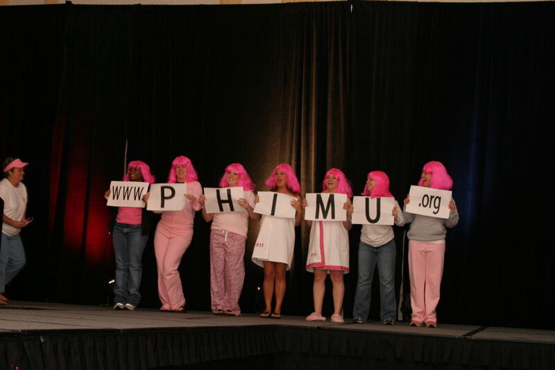 Phi Mus Holding Letters in Convention Fashion Show Photograph 4, July 8, 2004 (Image)