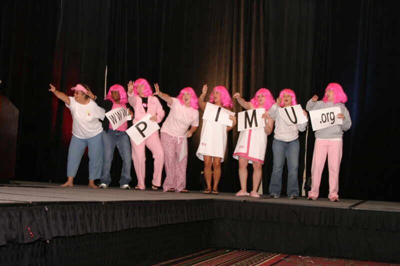 Phi Mus Holding Letters in Convention Fashion Show Photograph 5, July 8, 2004 (Image)