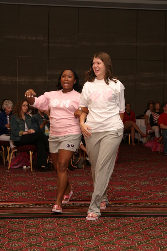 Two Phi Mus in Convention Fashion Show Photograph 1, July 8, 2004 (Image)
