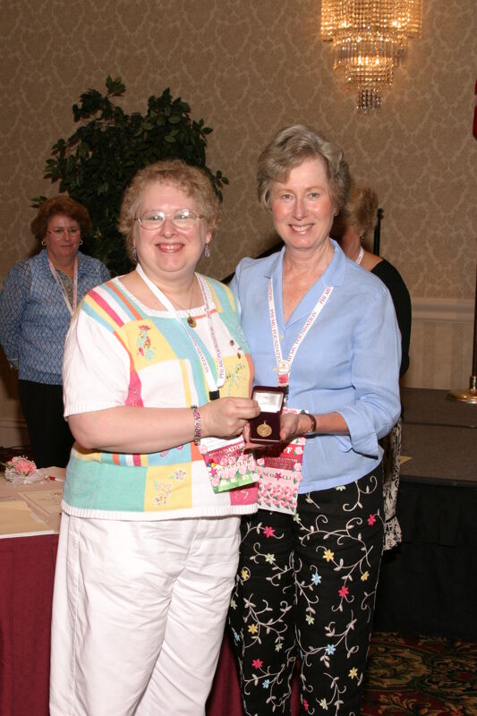 Lucy Stone and Unidentified at Convention Foundation Awards Presentation Photograph 10, July 9, 2004 (Image)