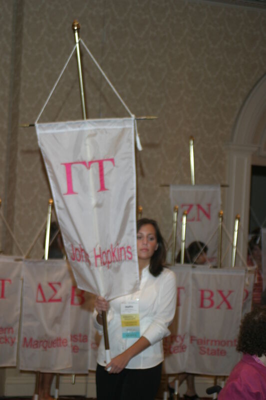 Unidentified Phi Mu With Gamma Tau Chapter Banner in Convention Parade of Flags Photograph, July 9, 2004 (Image)