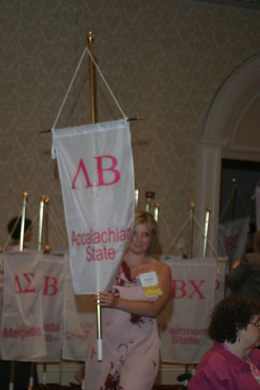 Unidentified Phi Mu With Lambda Beta Chapter Banner in Convention Parade of Flags Photograph, July 9, 2004 (image)