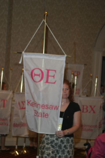 Unidentified Phi Mu With Theta Epsilon Chapter Banner in Convention Parade of Flags Photograph, July 9, 2004 (image)