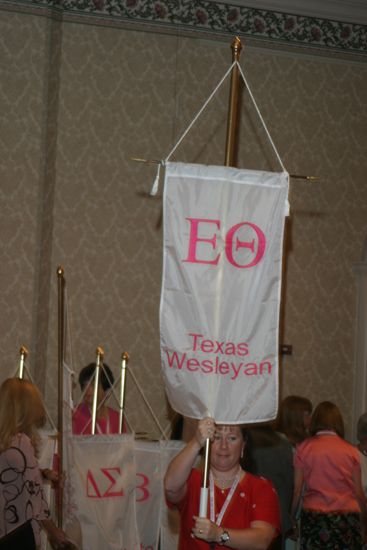 Unidentified Phi Mu With Epsilon Theta Chapter Banner in Convention Parade of Flags Photograph, July 9, 2004 (image)