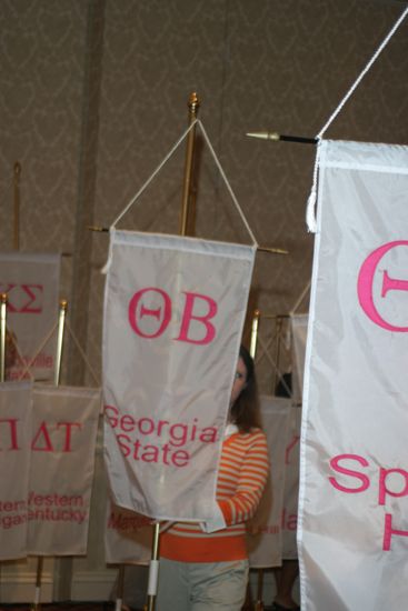 Unidentified Phi Mu With Theta Beta Chapter Banner in Convention Parade of Flags Photograph, July 9, 2004 (image)