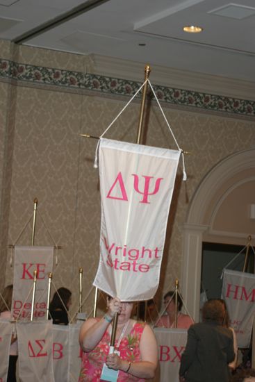 Unidentified Phi Mu With Delta Psi Chapter Banner in Convention Parade of Flags Photograph, July 9, 2004 (image)