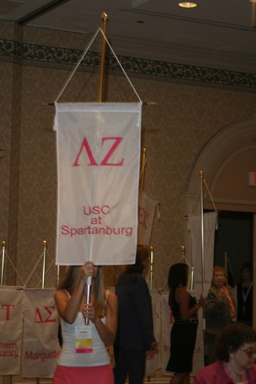 Unidentified Phi Mu With Lambda Zeta Chapter Banner in Convention Parade of Flags Photograph, July 9, 2004 (image)