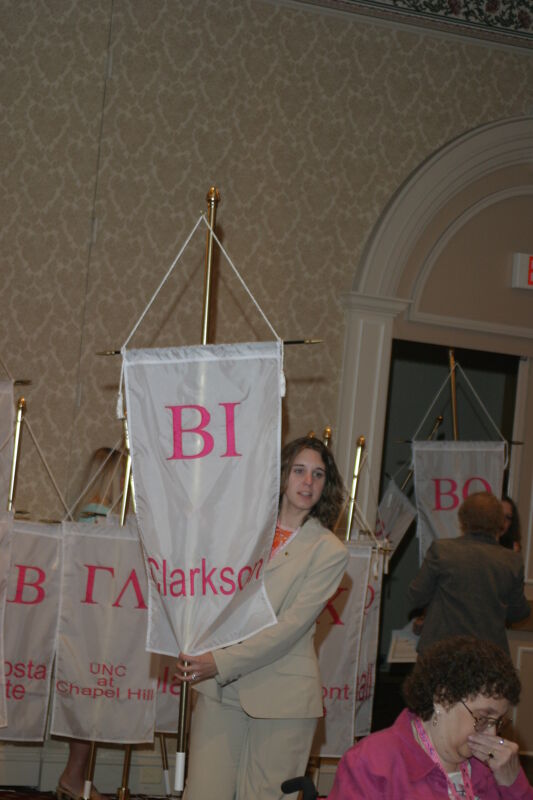 Unidentified Phi Mu With Beta Iota Chapter Banner in Convention Parade of Flags Photograph, July 9, 2004 (Image)