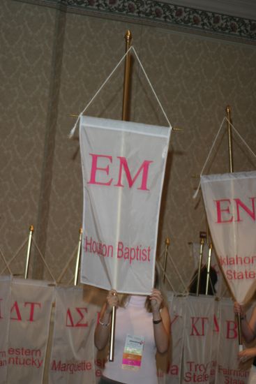 Jessica Smith With Epsilon Mu Chapter Banner in Convention Parade of Flags Photograph, July 9, 2004 (image)