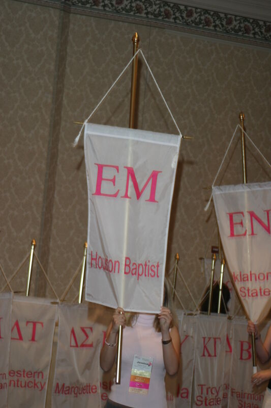 Jessica Smith With Epsilon Mu Chapter Banner in Convention Parade of Flags Photograph, July 9, 2004 (Image)