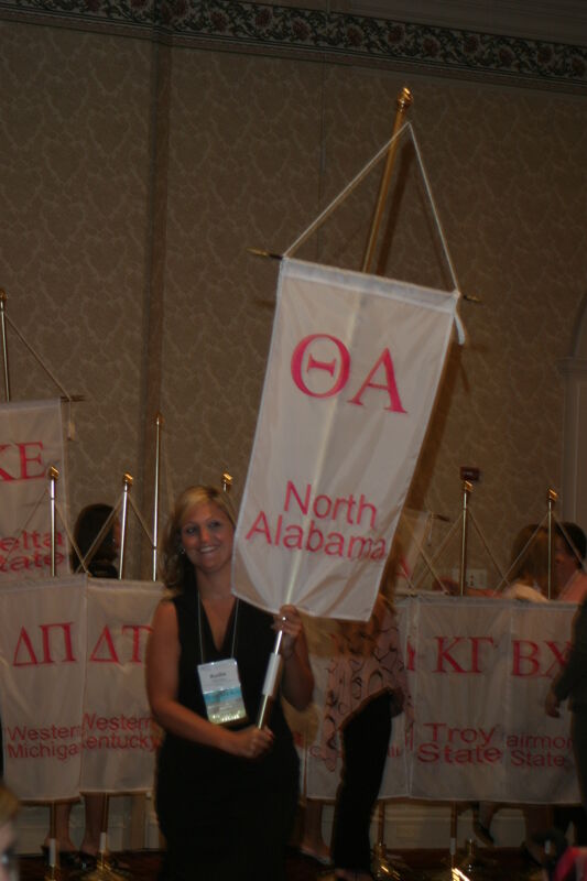 Unidentified Phi Mu With Theta Alpha Chapter Banner in Convention Parade of Flags Photograph, July 9, 2004 (Image)