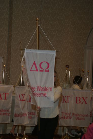 Unidentified Phi Mu With Delta Omega Chapter Banner in Convention Parade of Flags Photograph, July 9, 2004 (image)