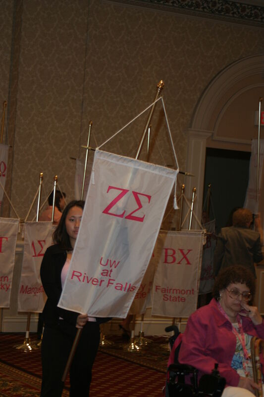Unidentified Phi Mu With Zeta Sigma Chapter Banner in Convention Parade of Flags Photograph, July 9, 2004 (Image)
