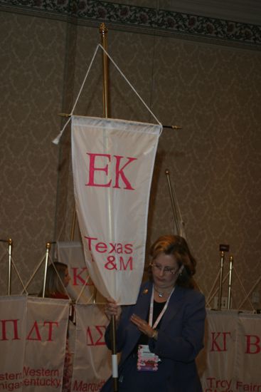 Unidentified Phi Mu With Epsilon Kappa Chapter Banner in Convention Parade of Flags Photograph, July 9, 2004 (image)