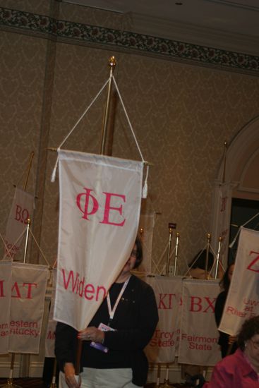 Unidentified Phi Mu With Phi Epsilon Chapter Banner in Convention Parade of Flags Photograph, July 9, 2004 (image)